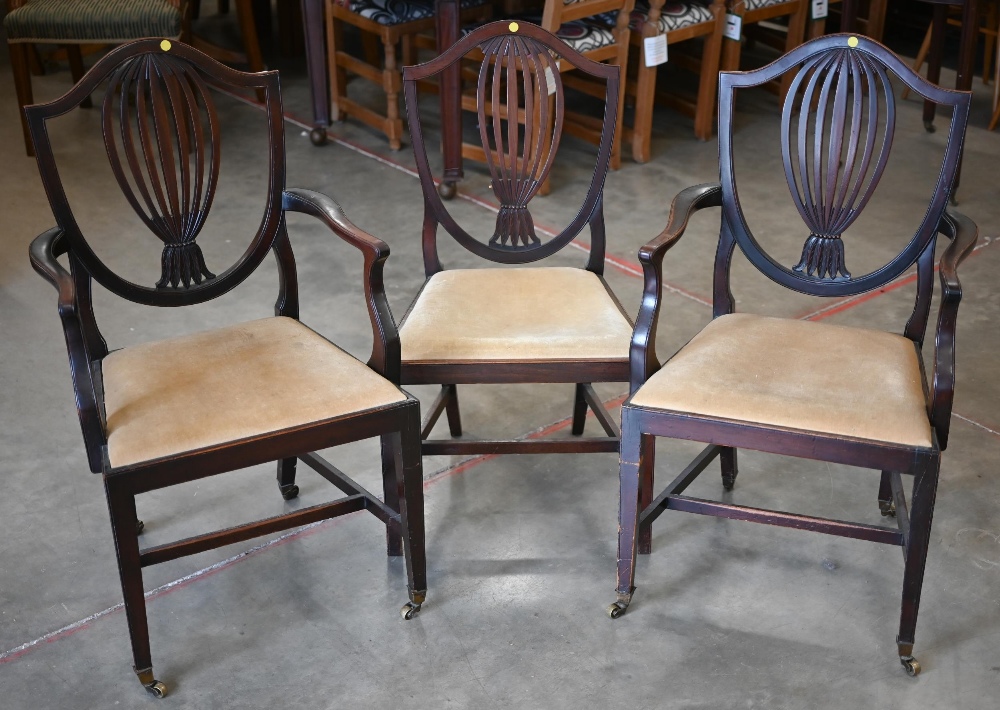 Pair of 19th century Hepplewhite style carver chairs and a single side chair