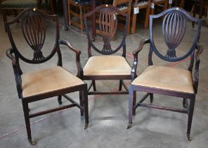 Pair of 19th century Hepplewhite style carver chairs and a single side chair