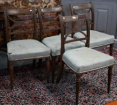 A set of four 'X' Regency mahogany dining side chairs, with overstuffed seats raised on turned front