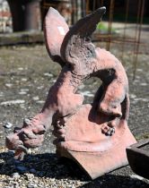 A reconstituted aged terracotta large 'dragon' ridge tile, 65 cm high