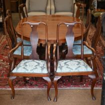 A set of eight Queen Anne style walnut dining chairs, with blue damask pad seats, comprising six