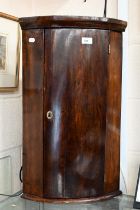 A small antique barrel front hanging corner cupboard, 65 cm h