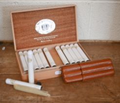 A box of twenty-six Medallion Petit Coronas cigars, in tubes, to/w a leather three-cigar slip-case