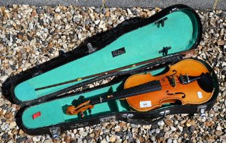 A Chinese Lark child's violin with 31 cm one piece back, in case with bow