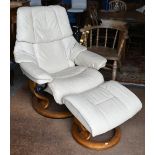An Ekornes Stressless cream leather reclining armchair amd matching footstool, a/f
