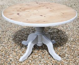 A part-painted pine circular dining table, turned column and quadraform supports, 120 cm dia. x 75