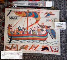 A section of the Bayeux tapestry wall hanging, and a souvenir ashtray and book etc