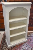 A white painted Laura Ashley(?) open bookcase with three adjustable shelves, 64 x 32 x 116 cm