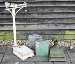 A vintage cast iron platform scale to/with a counter top platform scale, a Shell Aviation Spirit