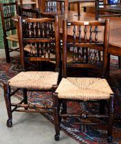 A set of six turned spindle-back Lancashire elm and rush-seated dining chairs (6)