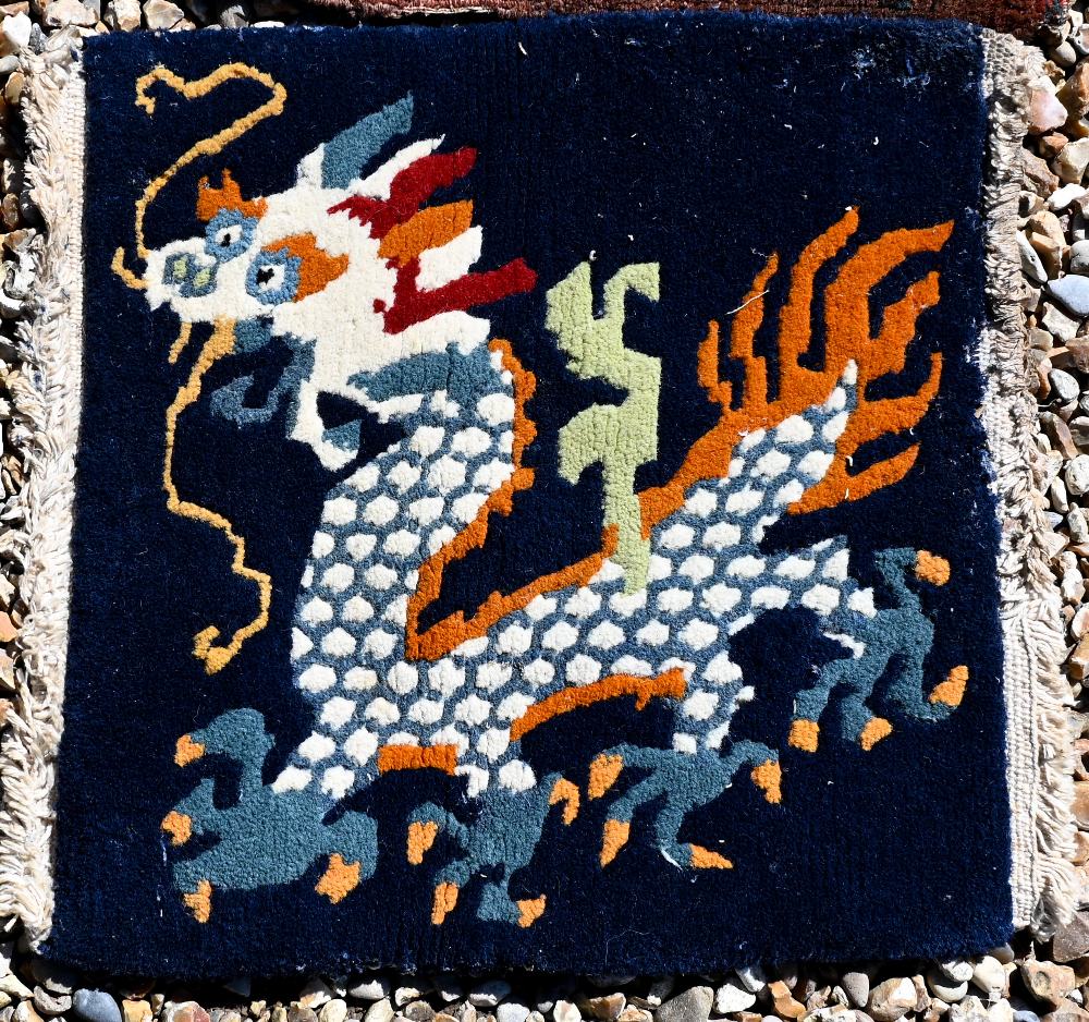 A Persian Quashqai bag face to/w Peking 'dragon' mat, fragment of blue fabric and hessian cushion - Image 5 of 9