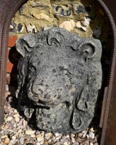 A large old lions head wall plaque, heavily weathered, 42 cm h