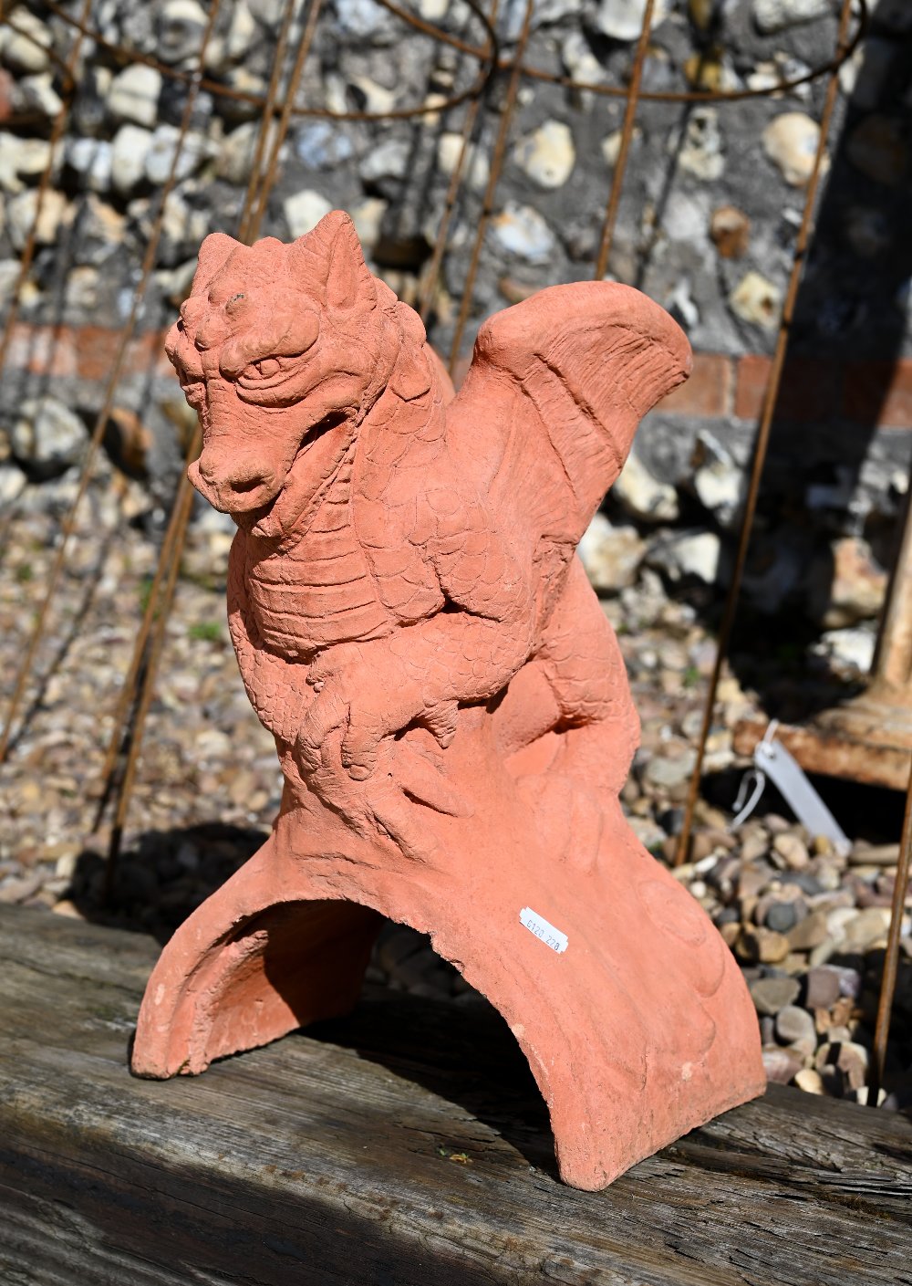 A small cast terracotta dragon ridge tile, 45 cm h