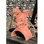 A small cast terracotta dragon ridge tile, 45 cm h