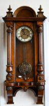 A Vienna-style walnut wall clock striking on a coiled gong with bi-metal compensating pendulum, 84