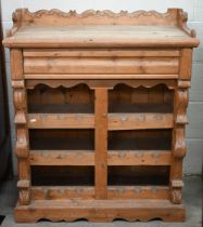 A rustic French pine wine rack cabinet with cavetto drawer over open shelves, 84 x 38 x 100 cm high