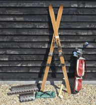 A pair of vintage wooden skis, 214 cm to/w to hickory-shafted niblicks and other golf clubs, two