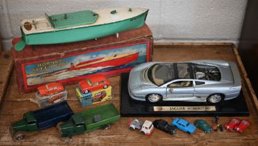 A vintage boxed Hornby clockwork Speedboat 'Swift' to/w two Tri-ang Minic trucks (a/f), a boxed
