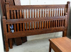 A chip-carved stained hardwood superking size bed frame, 200 cm wide