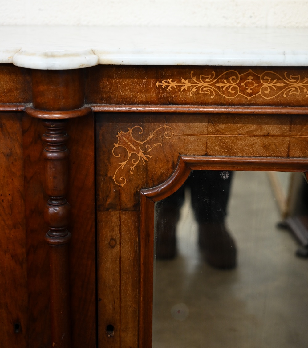 A Victorian walnut inlaid credenza with marble top over a mirrored central door between panelled - Image 2 of 5