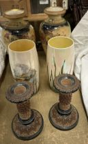 A pair of Doulton Lambeth stoneware candlesticks together with a pair of Royal Doulton fish