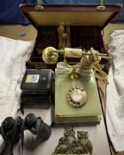 A Solingen gold plated part flatware service in a briefcase together with an onyx telephone,
