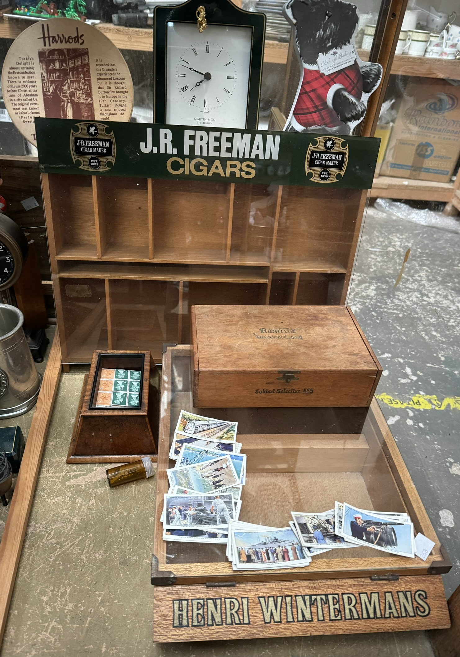 A J R Freeman Cigars table top display cabinet together with a Henry Wintermans display box,