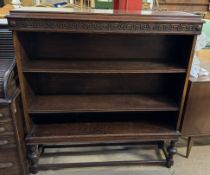 A late 19th century oil bookcase with a rectangular top above three shelves on turned legs united