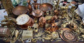 A copper kettle together with copper ewers, copper tankards, brass horses,