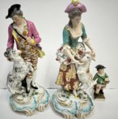 A pair of 19th Century English porcelain figures of a shepherd and shepherdess together with