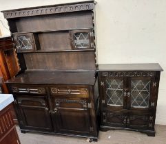 A 20th century oak dresser with glazed cupboards and shelves,