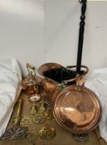 A copper coal scuttle together with a copper bedwarming pan, horse brasses, copper kettle,