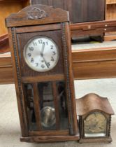 An oak cased wall clock together with an oak cased mantle clock