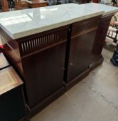 A pair of reproduction mahogany marble topped side cabinets with cupboard doors on a plinth