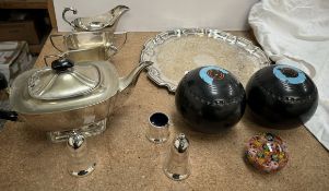 An electroplated three piece tea set together with a tray, sauce boat and cruets,