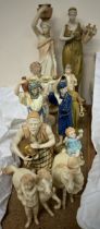 A Royal Worcester figure of a maiden holding a lyre together with a collection of Royal Worcester