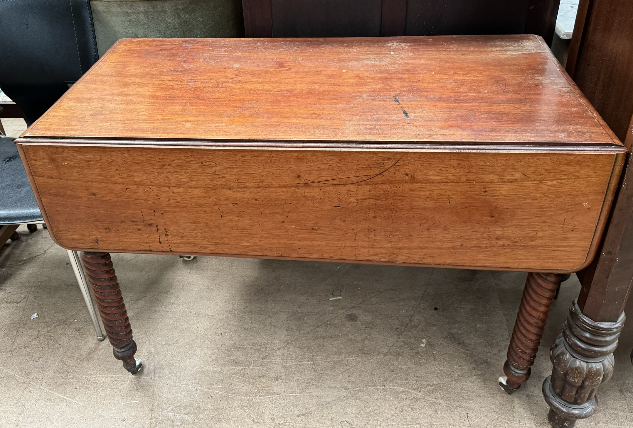 A Victorian mahogany Pembroke table with drop flaps and barley twist legs