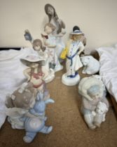A Lladro figure of an American Indian girl and dog together with Lladro polar bears,