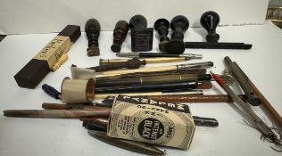 A collection of desk seals together with fountain pens etc