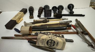 A collection of desk seals together with fountain pens etc
