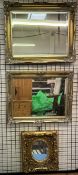 A gilt framed wall mirror with leaf moulded corners together with two other gilt wall mirrors