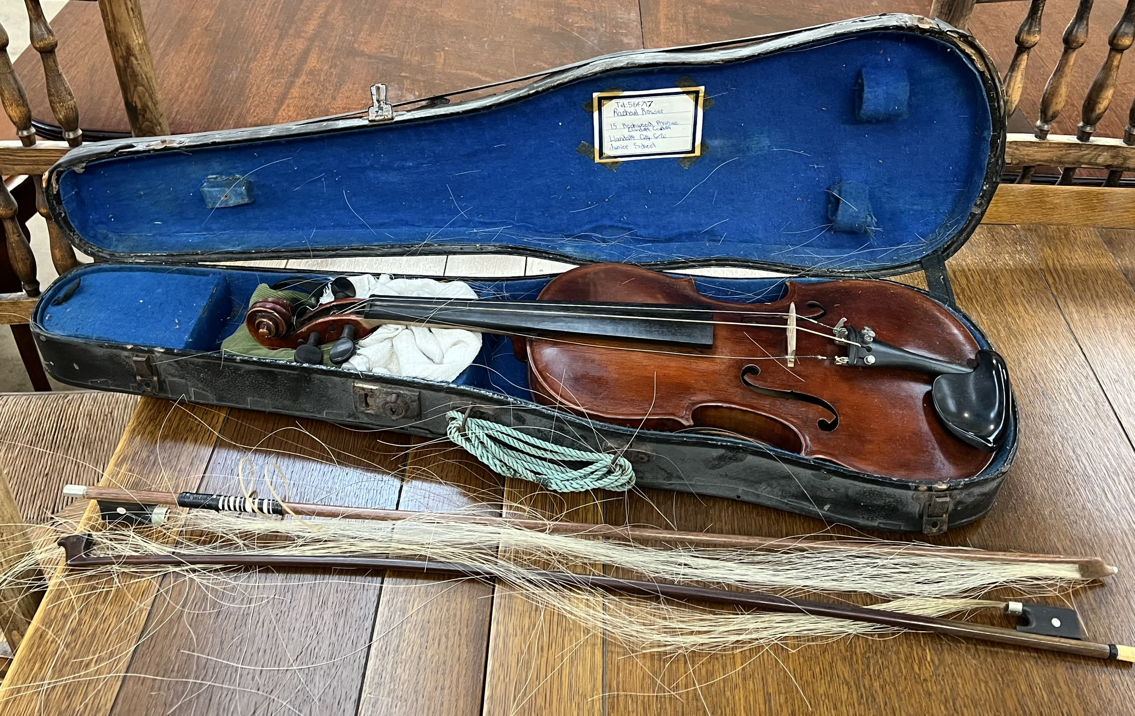 A violin with two piece back and ebonised stringing, bears a label for Antonious Stradivarius, 59.