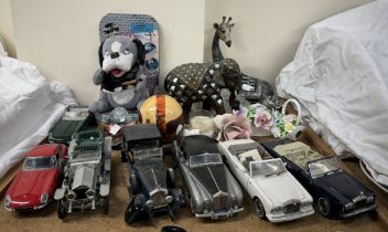 A collection of Franklin Mint model cars together with baskets of porcelain flowers etc