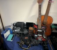 A Sakai electric guitar together with an acoustic guitar, Praktica camera, Lumix camera, binoculars,