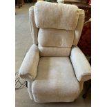 A cream coloured upholstered electric reclining chair