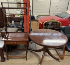 A reproduction mahogany supper table together with a towel rail and an oak side cabinet