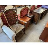 A reproduction mahogany pedestal desk with a serpentine front together with a ladderback elbow