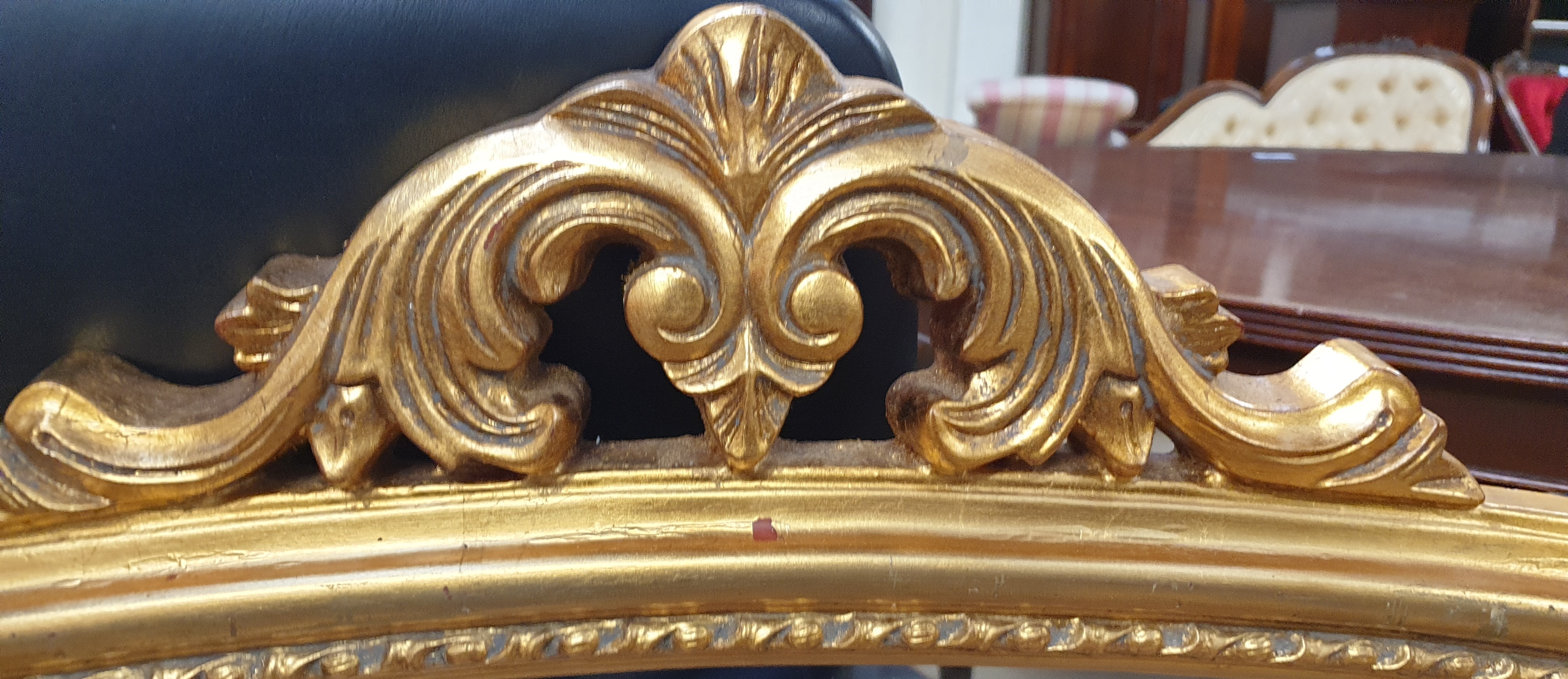 A Victorian style gilt overmantle mirror with a leaf carved cresting rail and scrolling sides - Image 4 of 5