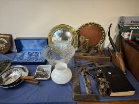 A brass circular mirror together with a brass tray, carved antelope head, woodworking tools,