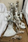 A Lladro figure of an angel together with a collection of Nao and Lladro figures